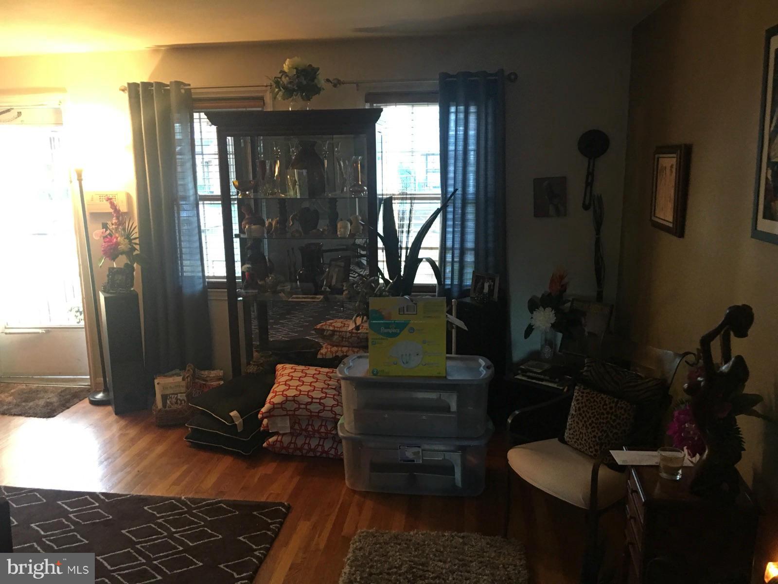1242 Cedarcroft Road Baltimore, MD 21239 - Photo 10 of 22 a hallway with furniture and wooden floor