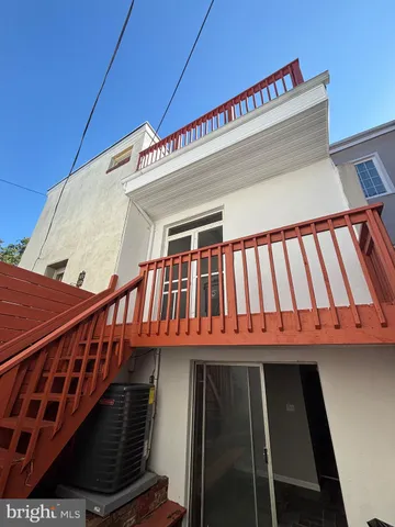 a view of a room with a large window