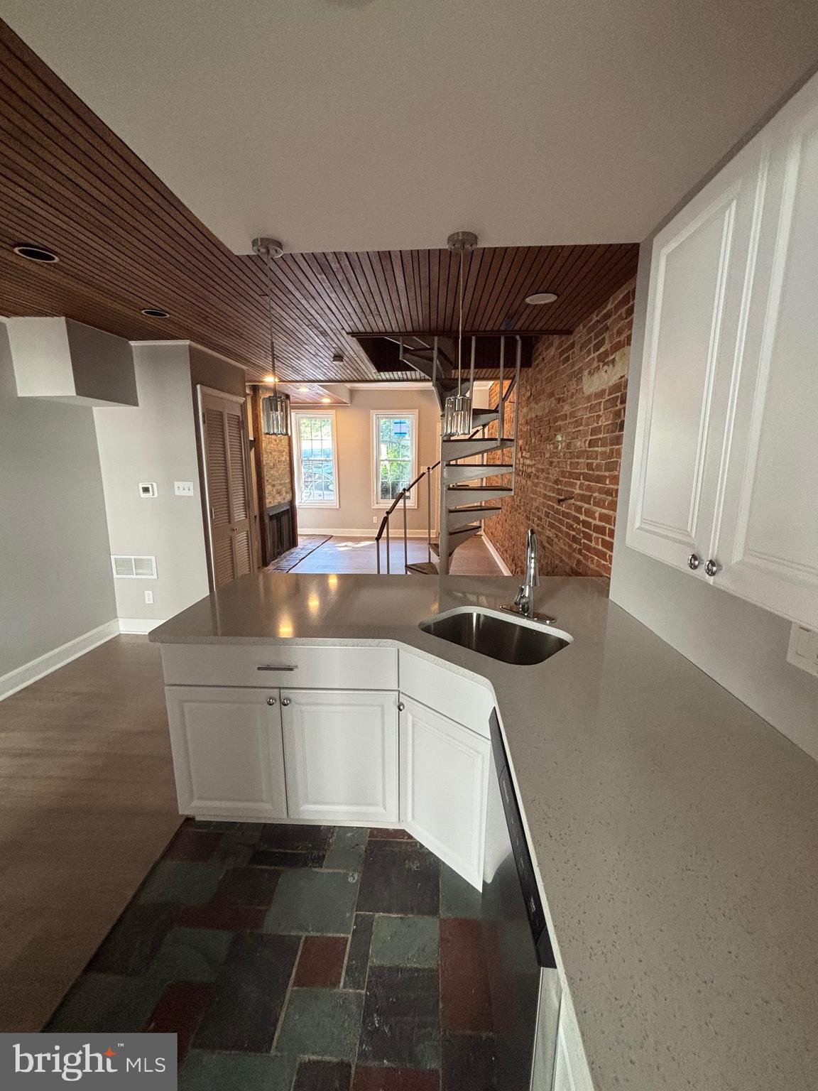903 Lovering Avenue Wilmington, DE 19806 - Photo 6 of 16 a kitchen with stainless steel appliances a stove a sink and a refrigerator