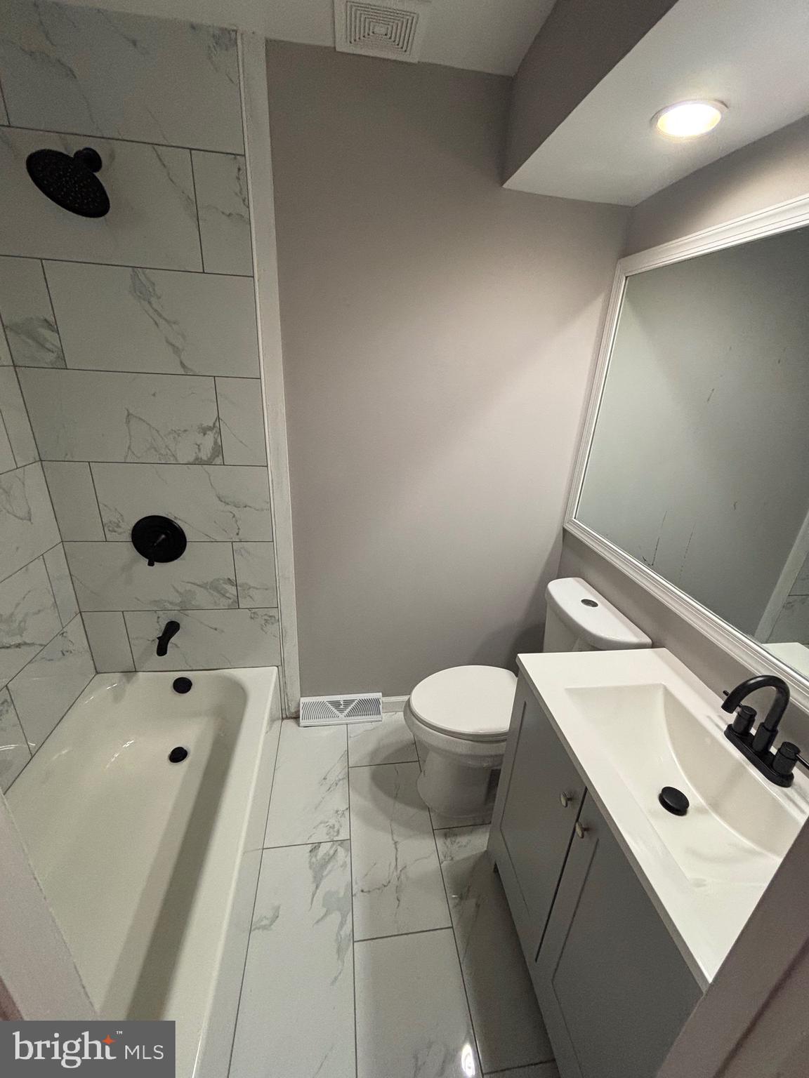 903 Lovering Avenue Wilmington, DE 19806 - Photo 8 of 16 a bathroom with a sink toilet and shower