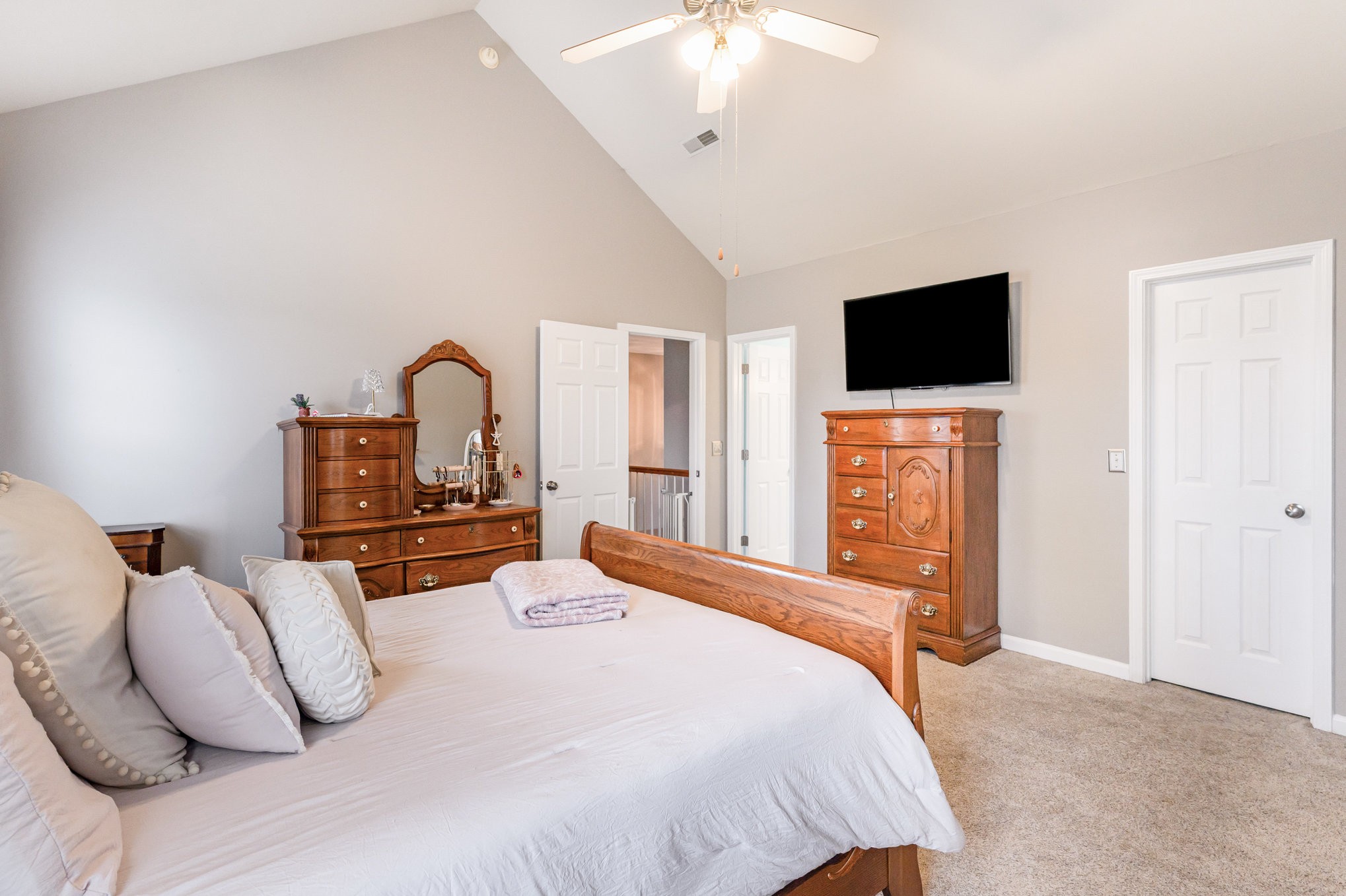 2261 Dewey Drive Spring Hill, TN 37174 - Photo 14 of 26 a bedroom with a bed and a flat screen tv