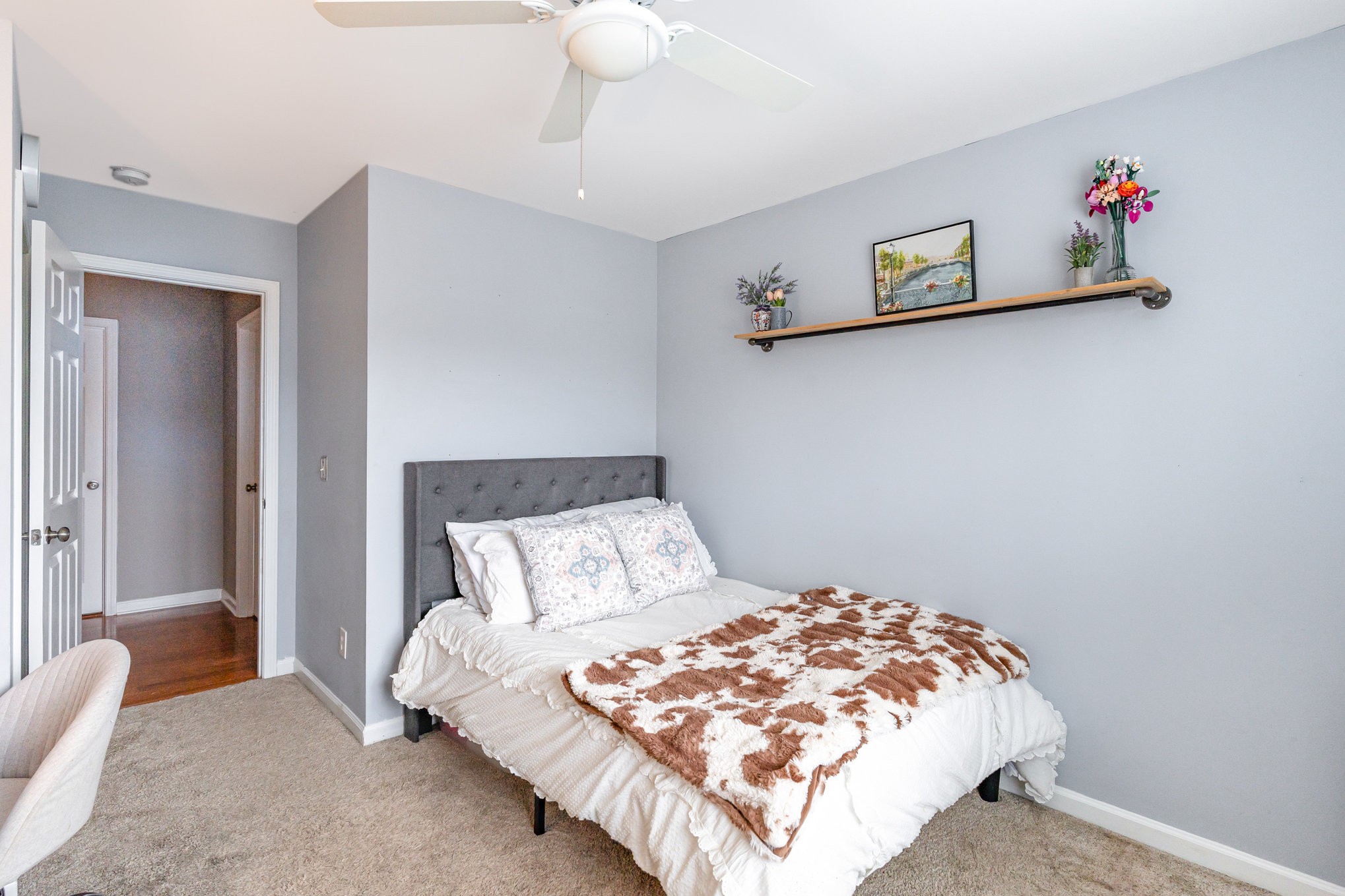 2261 Dewey Drive Spring Hill, TN 37174 - Photo 19 of 26 a bedroom with a bed and painting on the wall