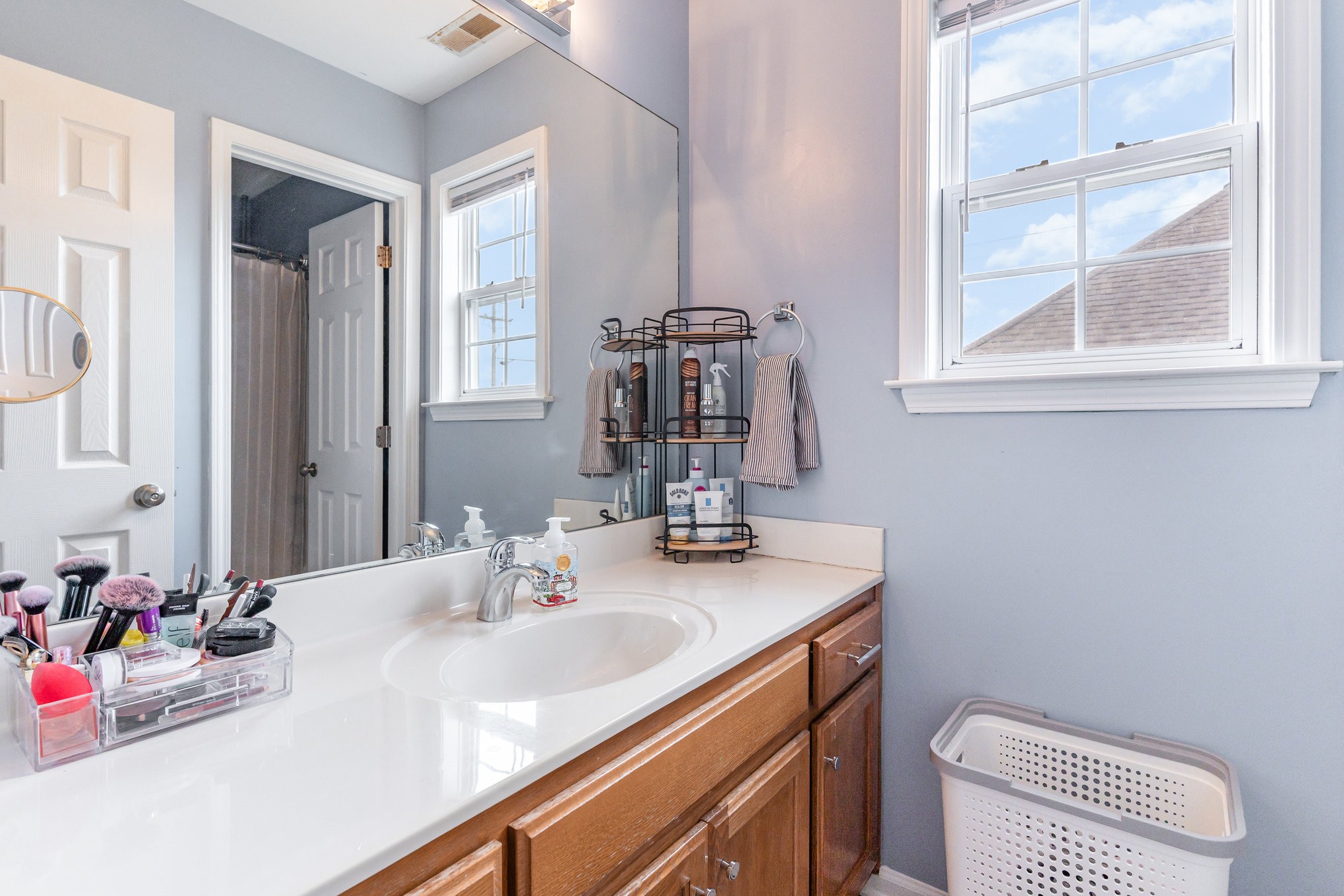 2261 Dewey Drive Spring Hill, TN 37174 - Photo 20 of 26 a bathroom with a sink vanity and a mirror