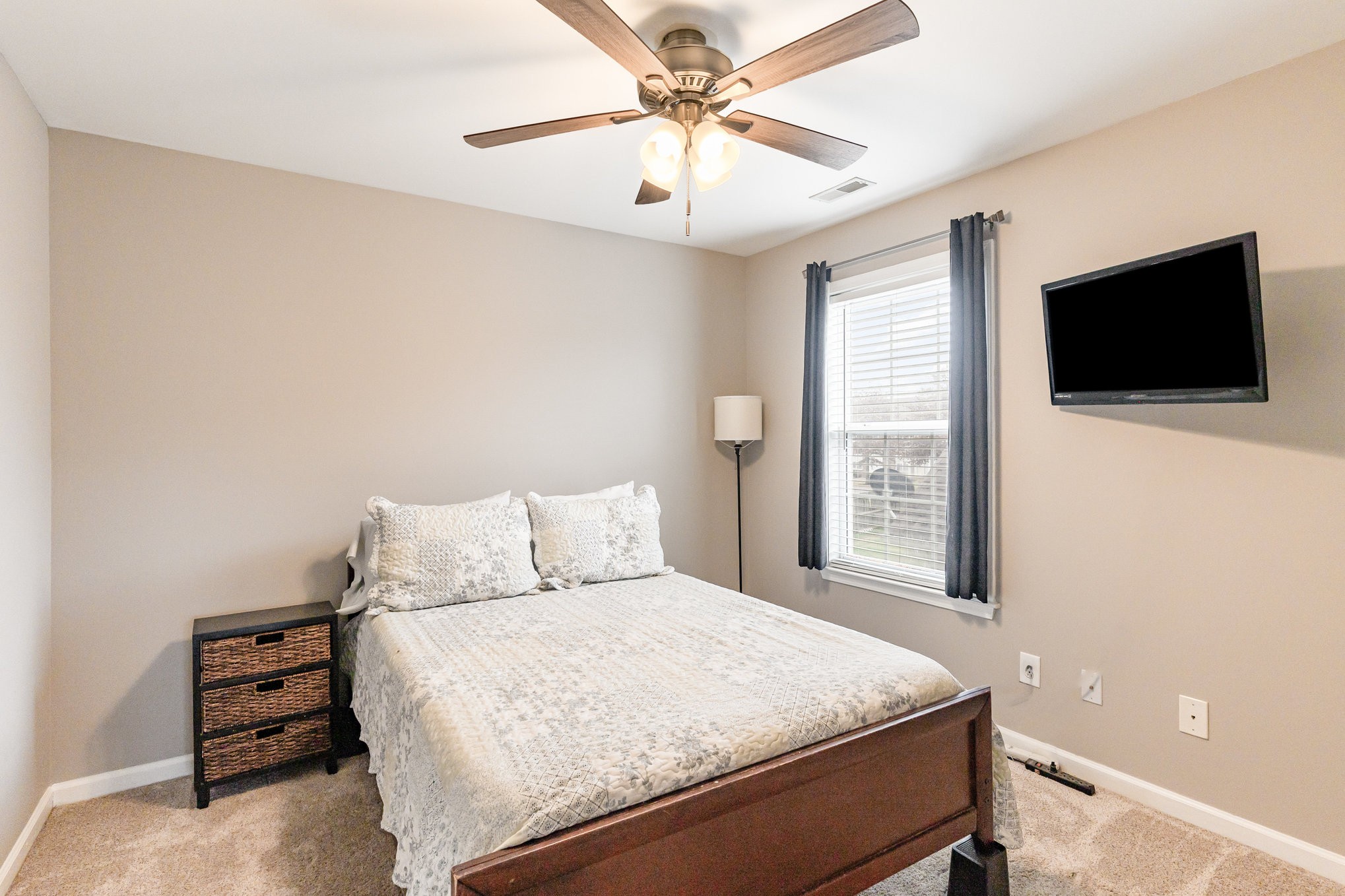 2261 Dewey Drive Spring Hill, TN 37174 - Photo 21 of 26 a bedroom with a bed and a flat screen tv