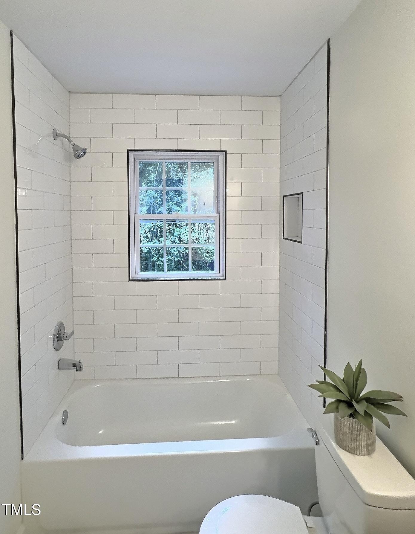 116 Lumpkin Street Raleigh, NC 27610 - Photo 12 of 20 a bathroom with a bathtub and shower