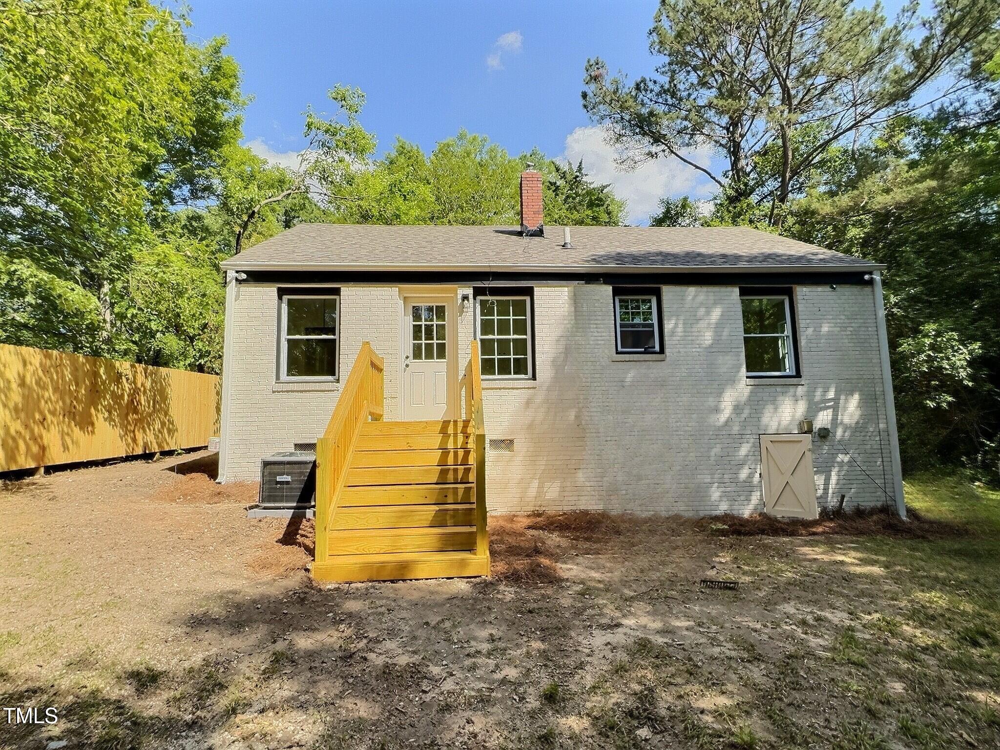 116 Lumpkin Street Raleigh, NC 27610 - Photo 18 of 20 a view of a house with backyard and a tree