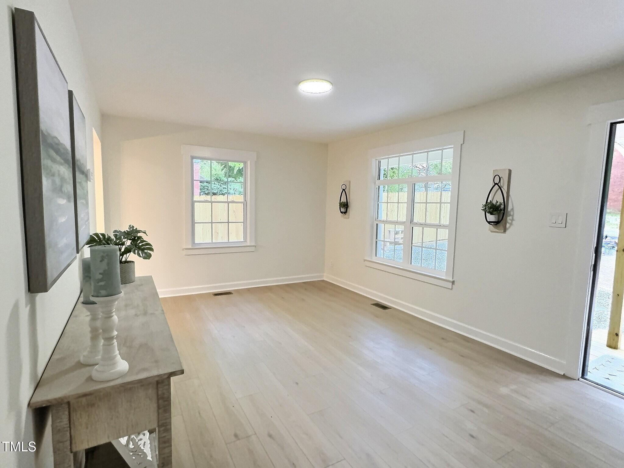 116 Lumpkin Street Raleigh, NC 27610 - Photo 6 of 20 an empty room with windows