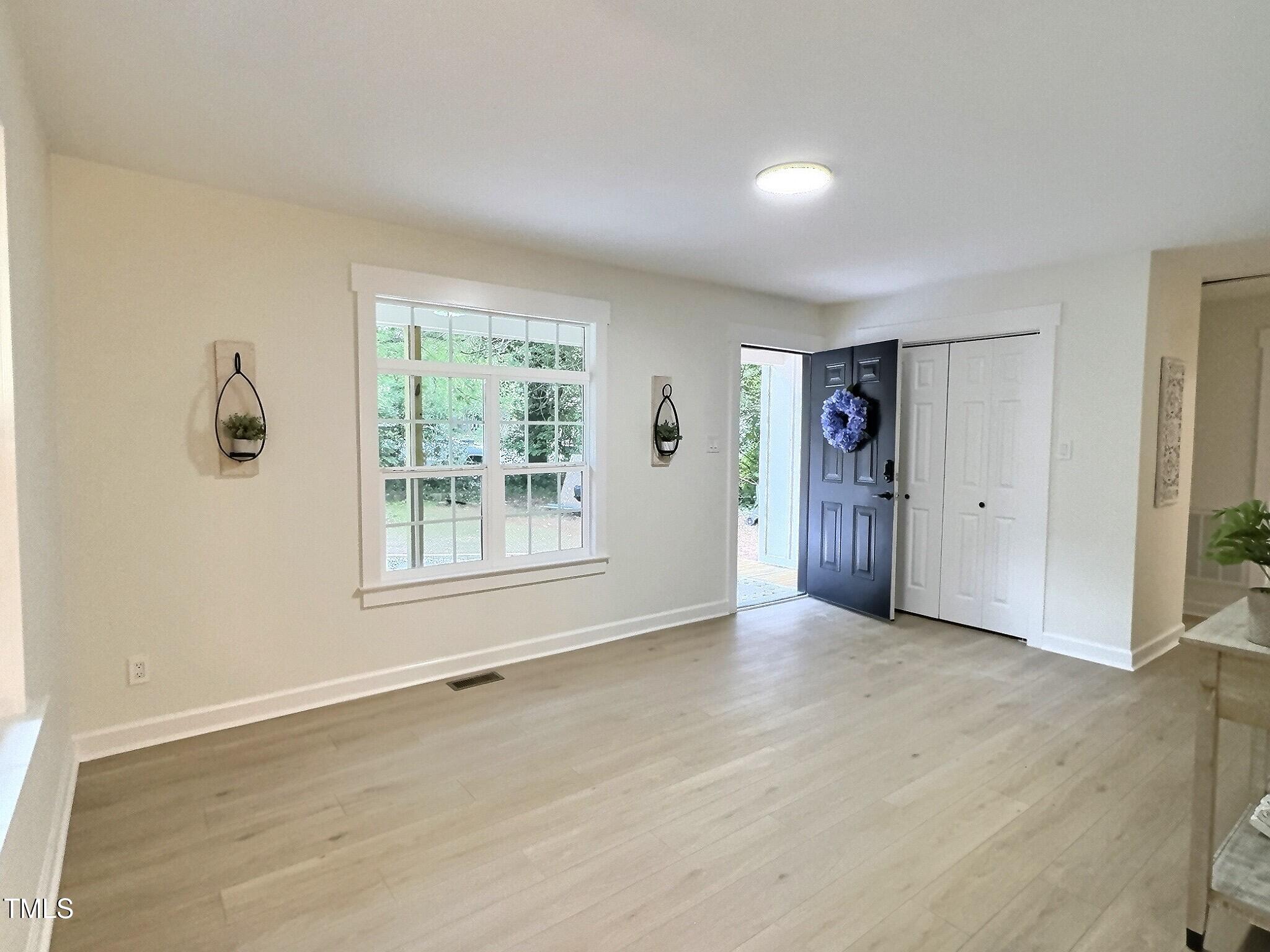 116 Lumpkin Street Raleigh, NC 27610 - Photo 7 of 20 a view of an empty room with a window