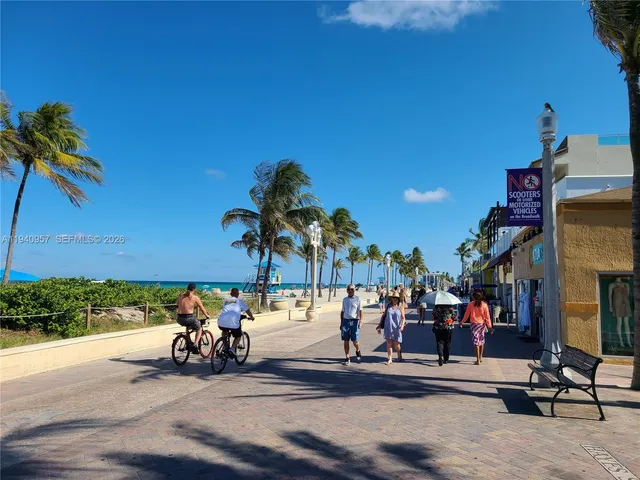 a view of a street with a bike and car