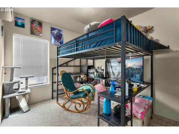 a dining room with furniture and a window