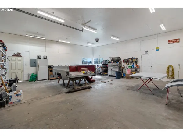 a living room with lots of furniture and a garage