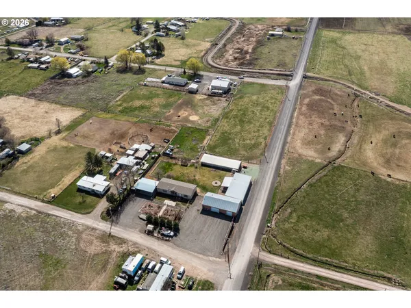 an aerial view of house with yard