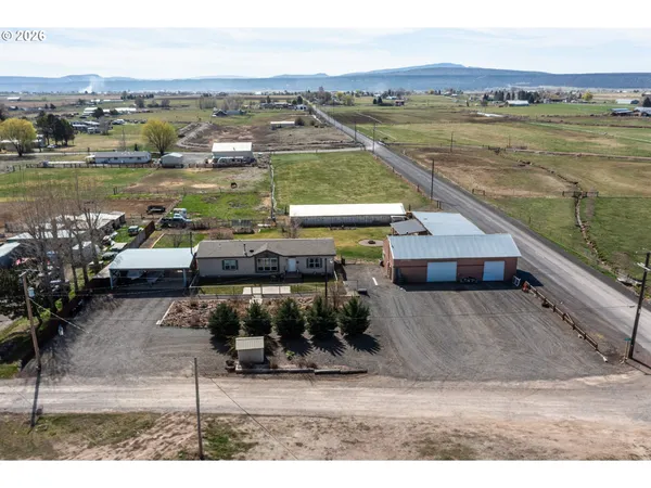 an aerial view of a house with a lake view