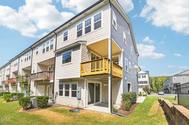 a view of a building with a yard
