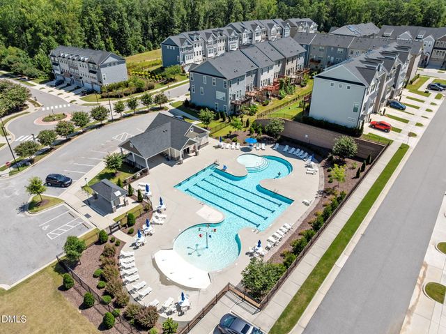 an aerial view of a house with a big yard