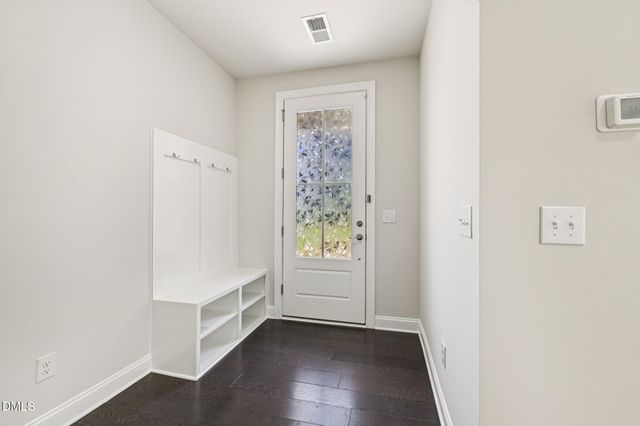 a view of an entryway with wooden floor
