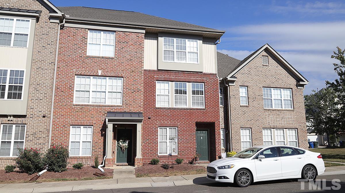 9818 Grettle Court Raleigh, NC 27617 - Photo 1 of 14 a car parked in front of a brick house