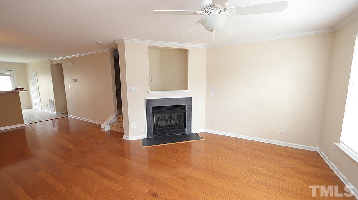 9818 Grettle Court Raleigh, NC 27617 - Photo 13 of 14 a view of a livingroom with a fireplace