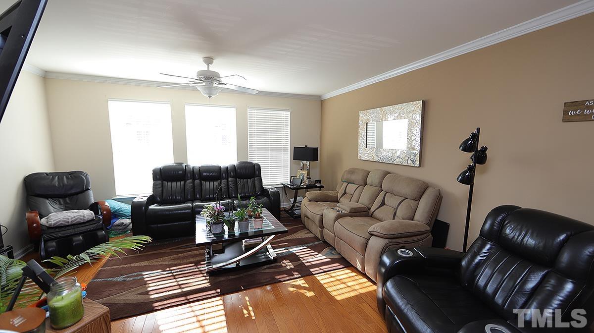 9818 Grettle Court Raleigh, NC 27617 - Photo 3 of 14 a living room with furniture and a window
