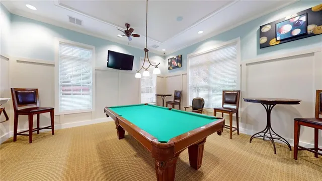 a room with furniture and a flat screen tv