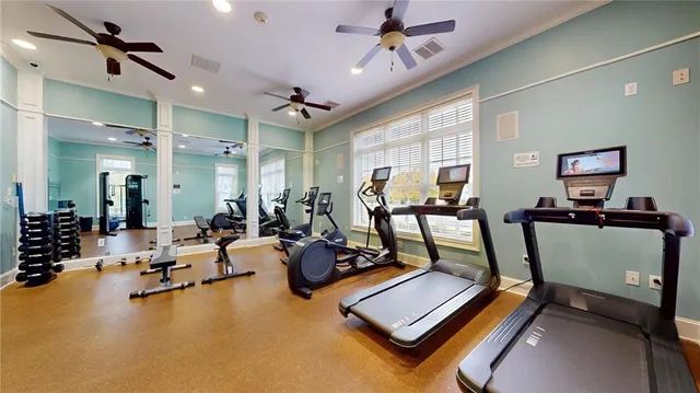 a room with gym equipment and a table