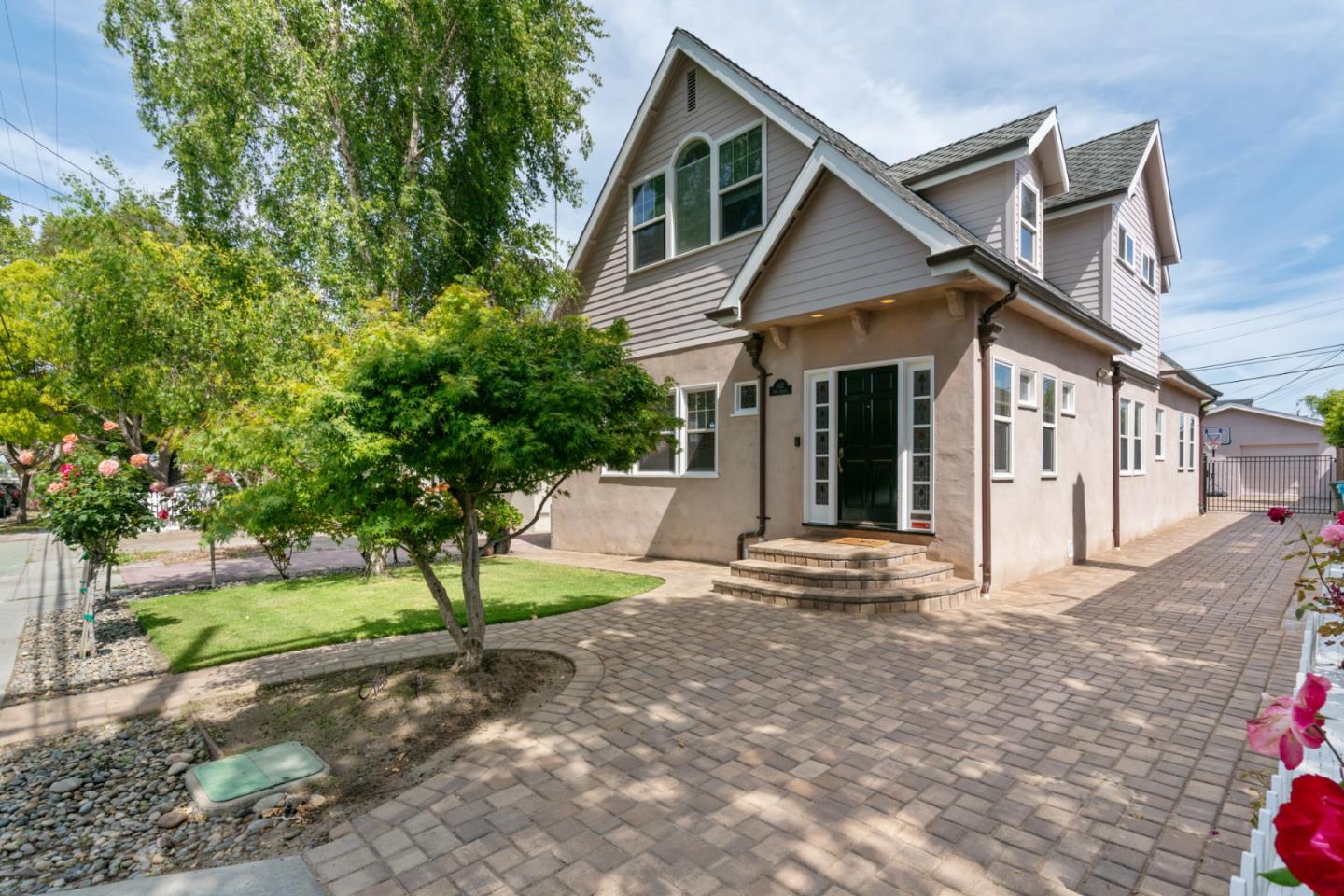 142 16th Avenue San Mateo, CA 94402 - Photo 1 of 25 a view of a house with a yard and large tree