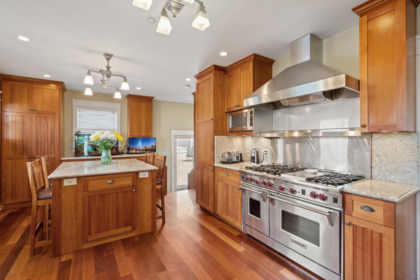 142 16th Avenue San Mateo, CA 94402 - Photo 11 of 25 a kitchen with a stove and a refrigerator