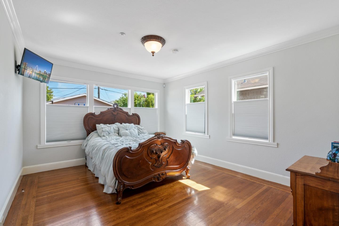 142 16th Avenue San Mateo, CA 94402 - Photo 13 of 25 a bed room with a bed and a chair
