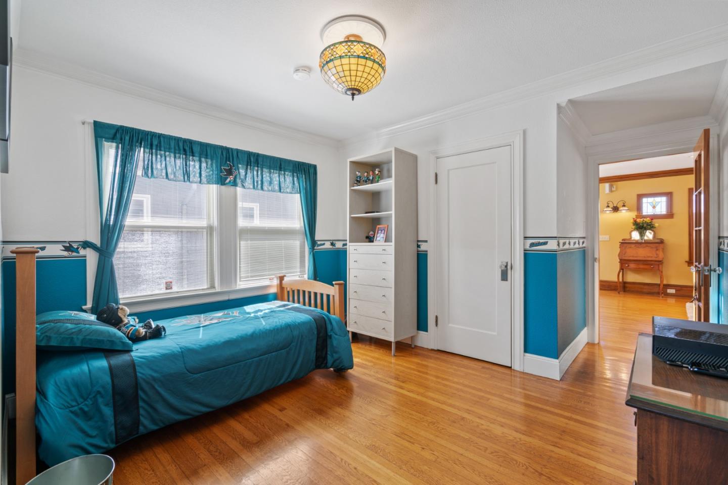 142 16th Avenue San Mateo, CA 94402 - Photo 15 of 25 a bedroom with a bed and a window