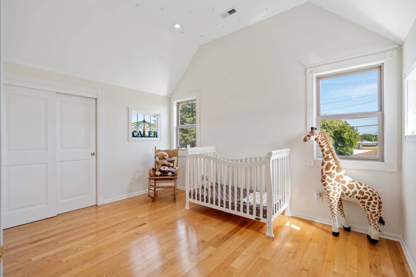 142 16th Avenue San Mateo, CA 94402 - Photo 19 of 25 a view of a bedroom with furniture and windows