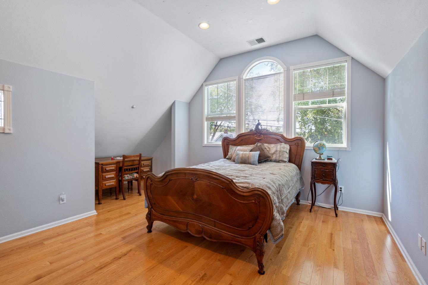 142 16th Avenue San Mateo, CA 94402 - Photo 22 of 25 a bedroom with a bed and a window