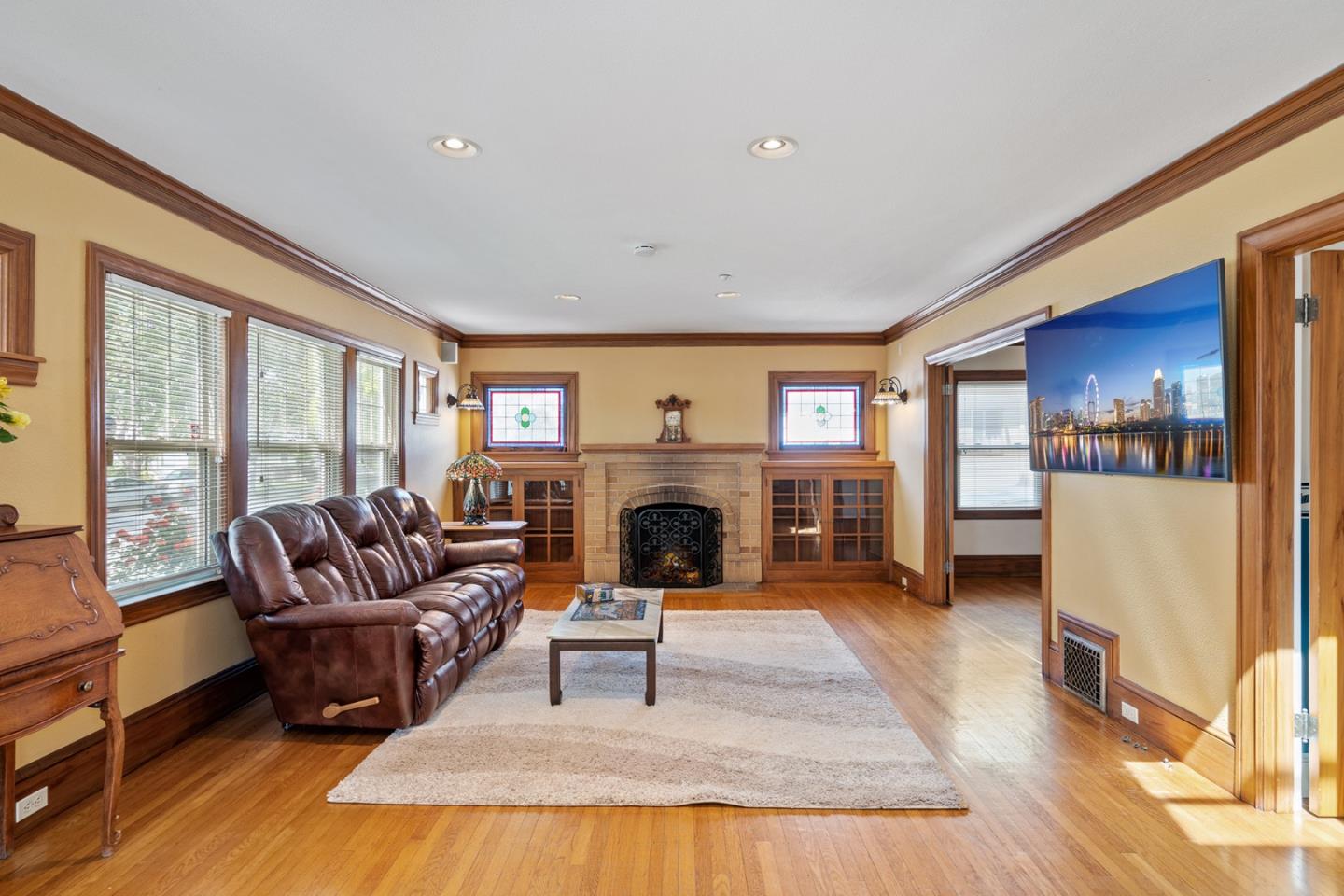 142 16th Avenue San Mateo, CA 94402 - Photo 5 of 25 a living room with furniture and a fireplace