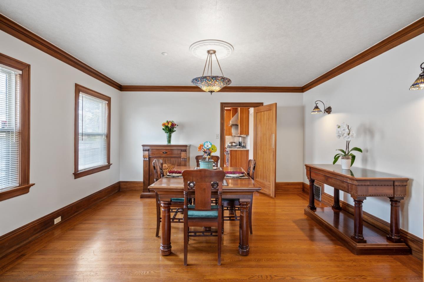 142 16th Avenue San Mateo, CA 94402 - Photo 7 of 25 a view of a dining room with furniture window and wooden floor