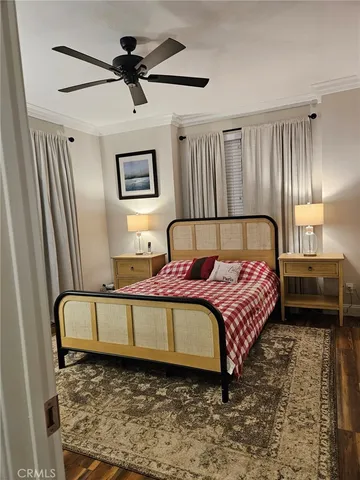 a bedroom with a bed dresser and a window