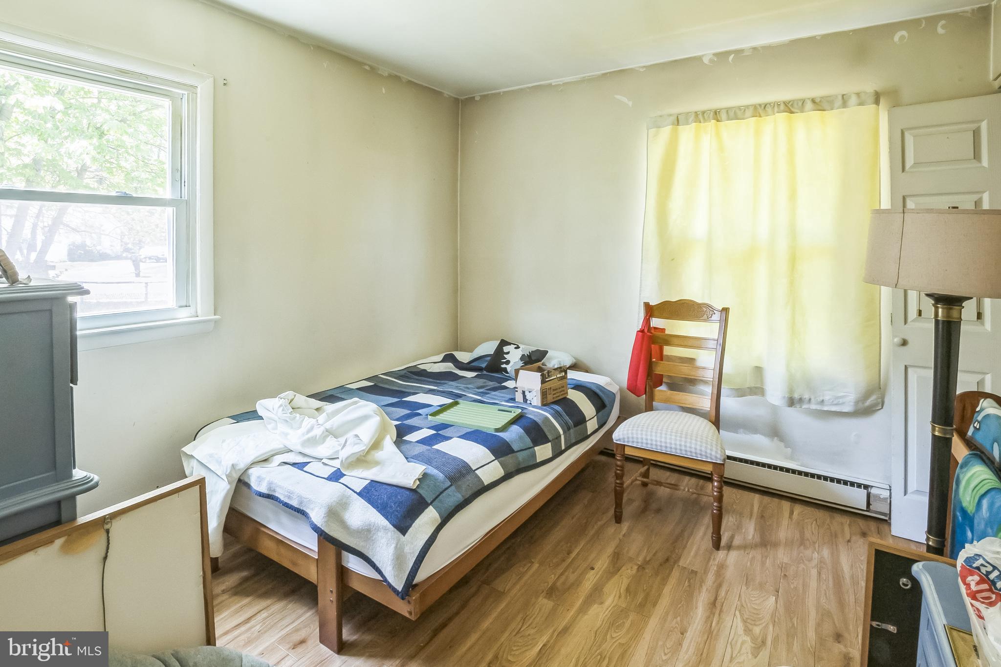 9 Queens Way Newark, DE 19713 - Photo 20 of 28 a bed sitting in a bedroom next to a window