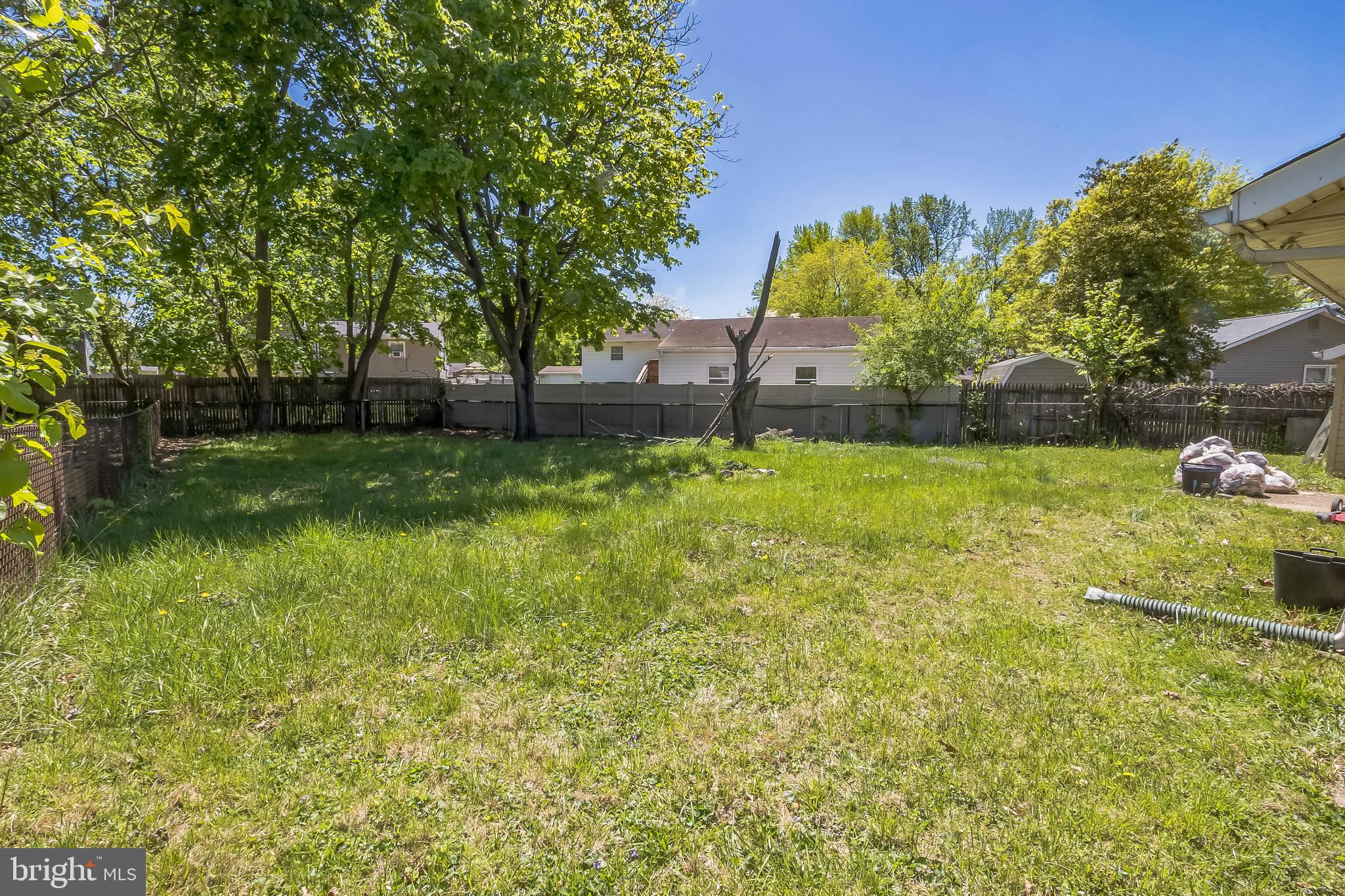 9 Queens Way Newark, DE 19713 - Photo 26 of 28 a view of a backyard with large trees