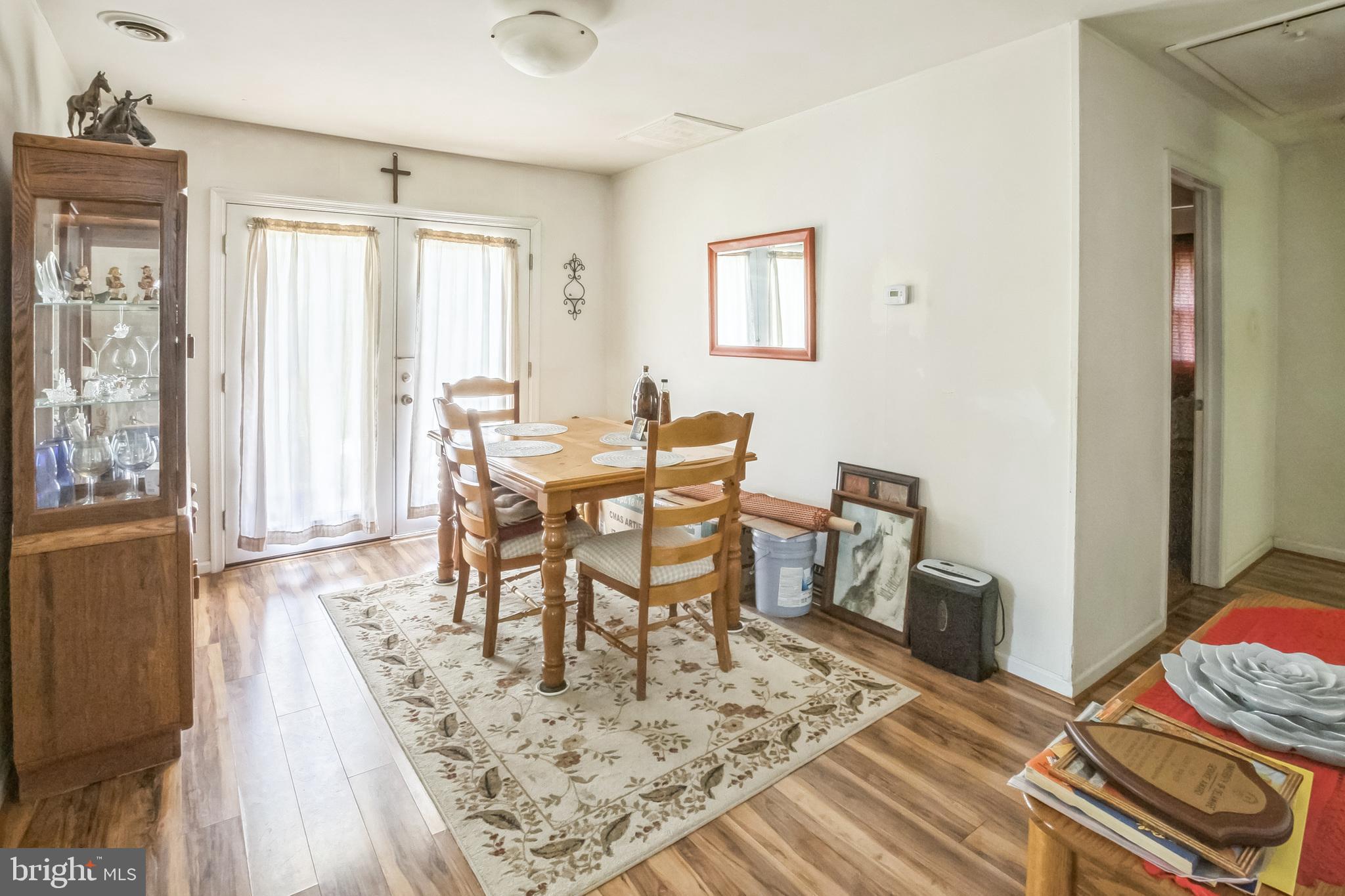 9 Queens Way Newark, DE 19713 - Photo 8 of 28 a view of a dining room with furniture and wooden floor