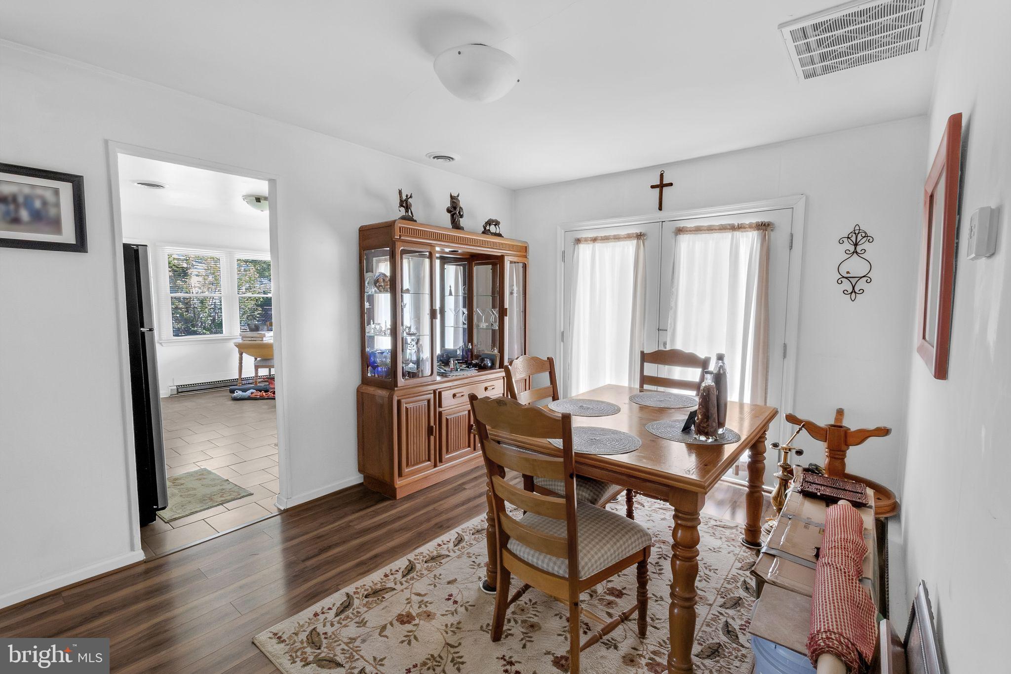 9 Queens Way Newark, DE 19713 - Photo 10 of 28 a view of a dining room with furniture and wooden floor