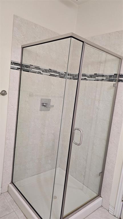 706 South Jupiter Road, Unit 1507 Allen, TX 75002 - Photo 13 of 31 a bathroom with a glass shower door