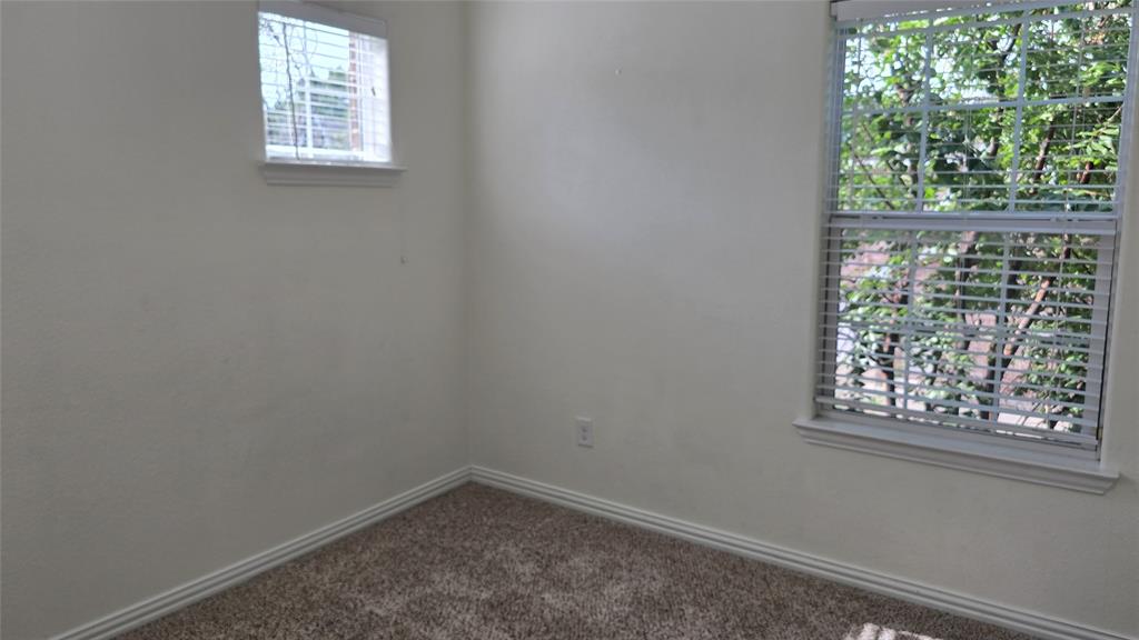 706 South Jupiter Road, Unit 1507 Allen, TX 75002 - Photo 19 of 31 an empty room with a window