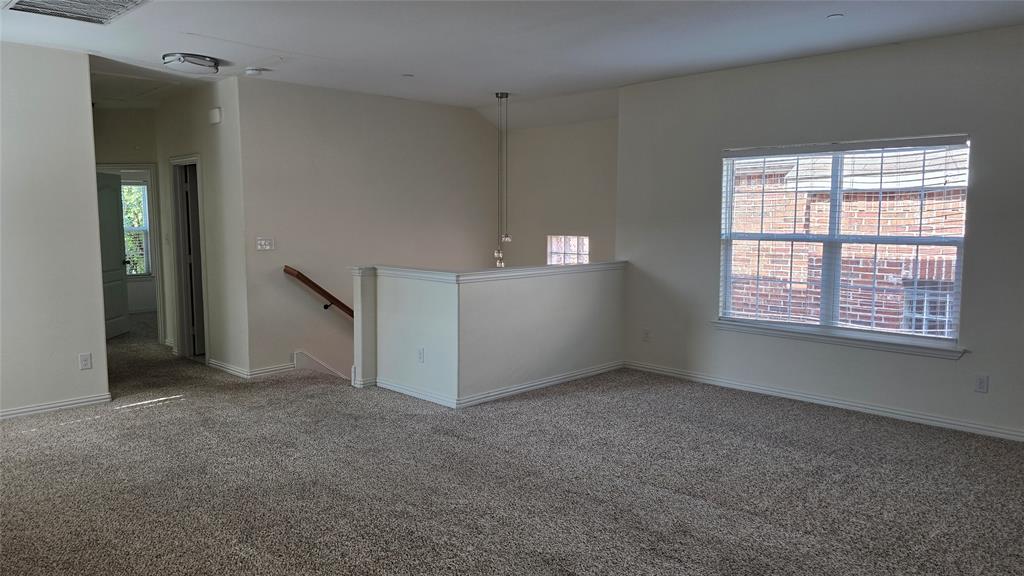 706 South Jupiter Road, Unit 1507 Allen, TX 75002 - Photo 23 of 31 an empty room with windows