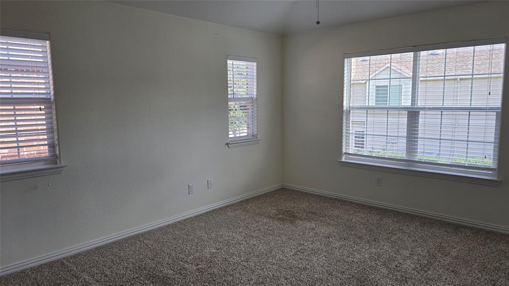 706 South Jupiter Road, Unit 1507 Allen, TX 75002 - Photo 24 of 31 an empty room with a window