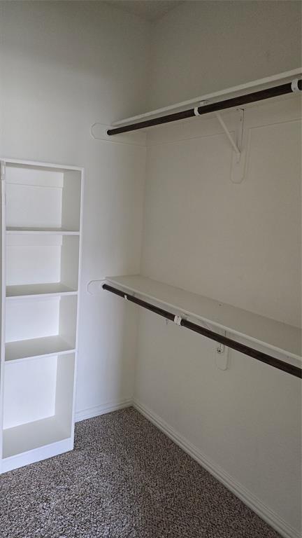 706 South Jupiter Road, Unit 1507 Allen, TX 75002 - Photo 26 of 31 a view of an empty walk in closet