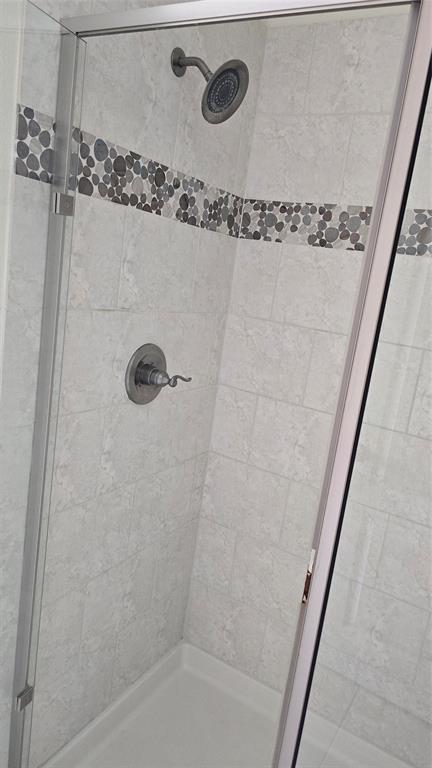 706 South Jupiter Road, Unit 1507 Allen, TX 75002 - Photo 30 of 31 a bathroom with a shower