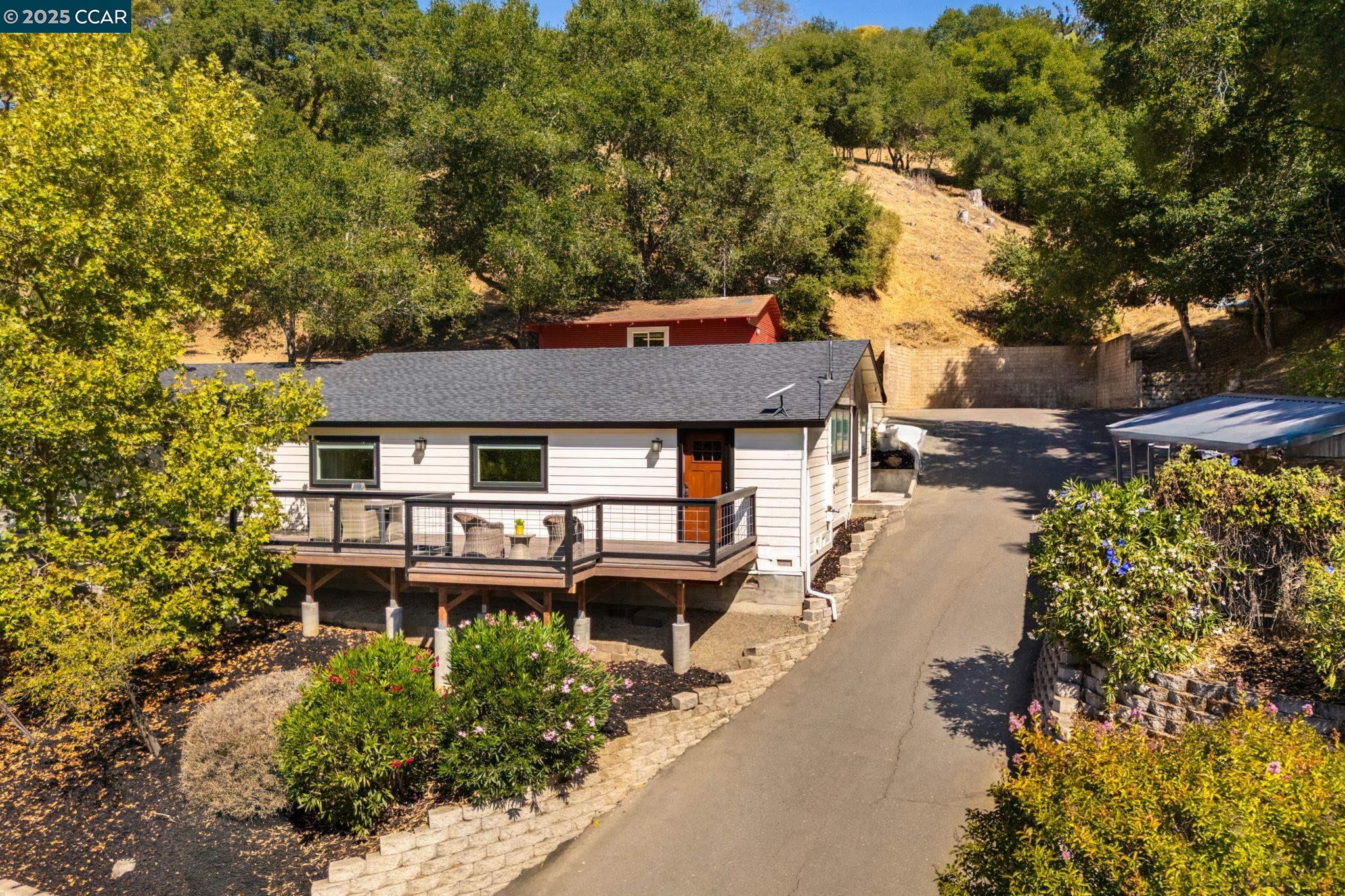 an aerial view of a house with a yard