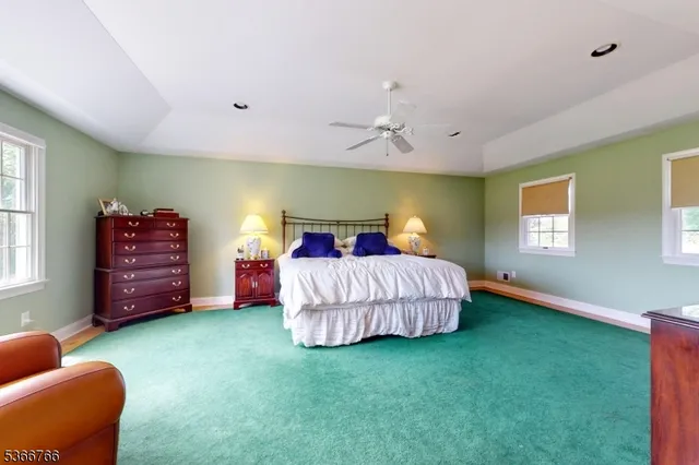 a bedroom with a bed and a chair