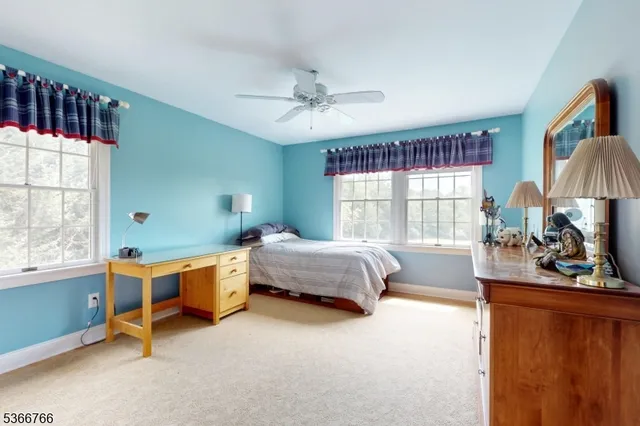a bed room with furniture and a window