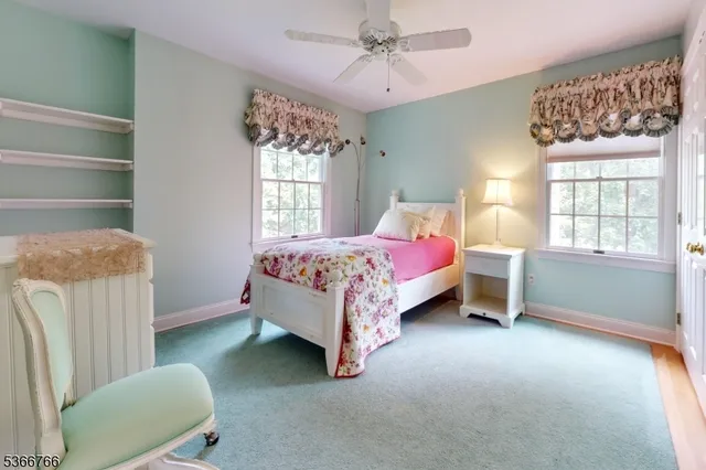 a bed room with a bed and a chair