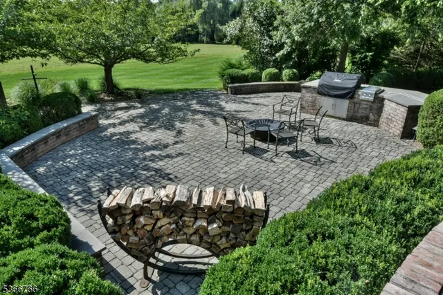 a view of a chair and table in backyard
