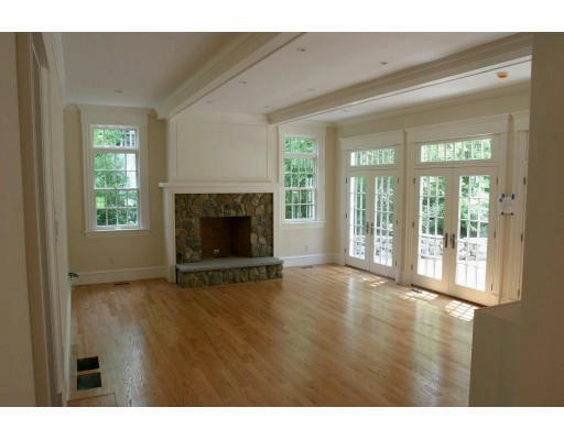 64 Old Colony Road Wellesley, MA 02481 - Photo 4 of 10 a view of an empty room with wooden floor and a window